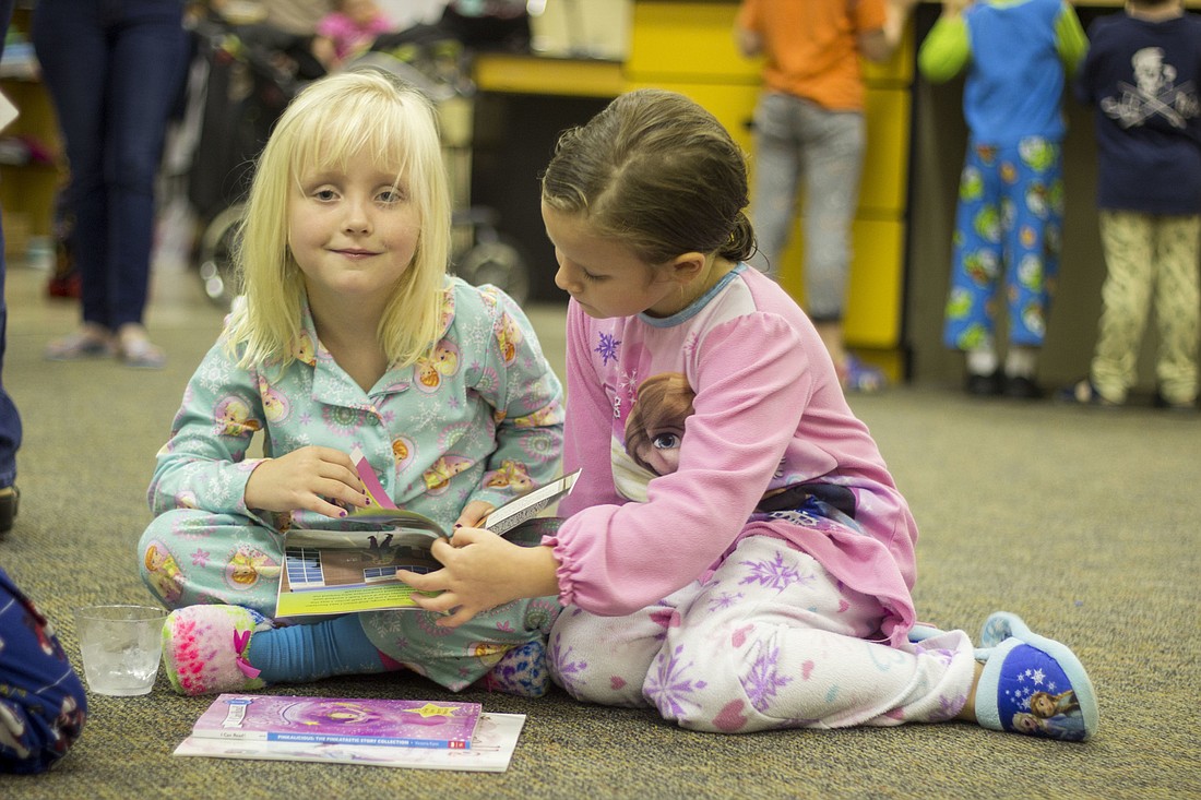 Five-year-olds  Noelle Boxrud and Amelia Hall found themselves completely engrossed in a Taylor Swift book (Photos by Emily Blackwood).
