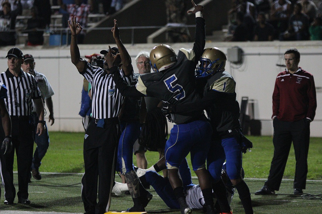 Randy Baker celebrated with Houston after his go-ahead touchdown from a quarterback keep. Photo by Jeff Dawsey