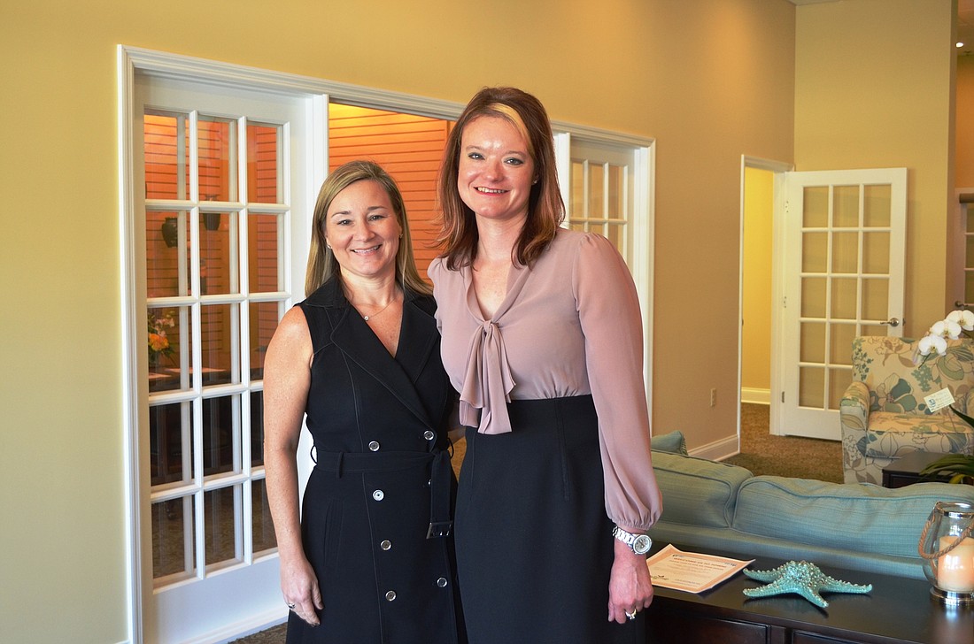 Ruth Anne Yeats, vice president, and Christina Stanley, manager, stand in the new Baldwin Brothers Planning Center in the Tuscany Shoppes on West Granada Boulevard.  Courtesy photo