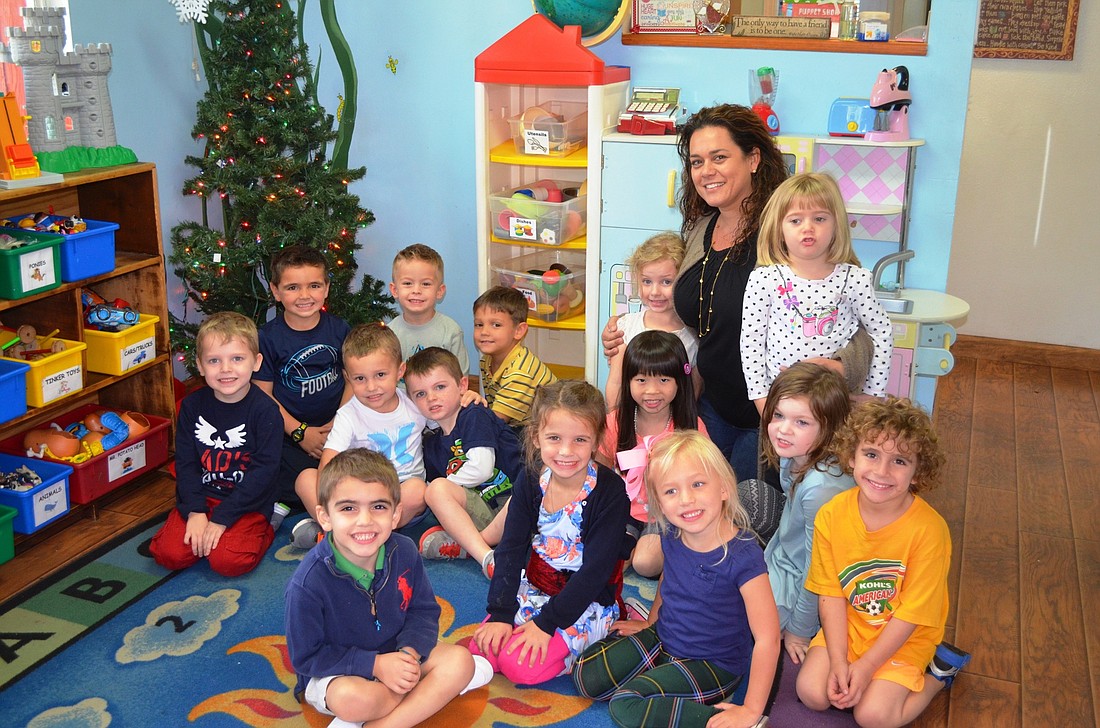 The VPK class, 4-year-olds, gather for a photo. The three in front: Theodore Koulouris, Estelle Roberson and Caroline Adams; second row: Michael Weingart, Jax Roberson, Finn Kimble, Natalie Bevacqua, Emma Burgess and Jake Ginocchetti; in back by tree: Aja