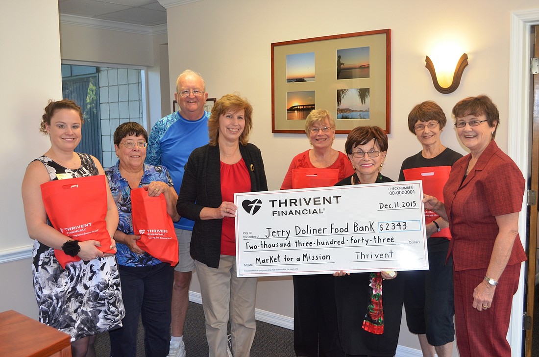 Thrivent Financial presented a check to Jerry Doliner Food Bank. Shown are Katherine Kyle, Linda Muchow; Larry Muchow; Diane Skelley; Martha Prestipino; Gloria Max, of Jerry Doliner Food Bank; Ann Jacoby; and Becky Lester. Photo by Wayne Grant