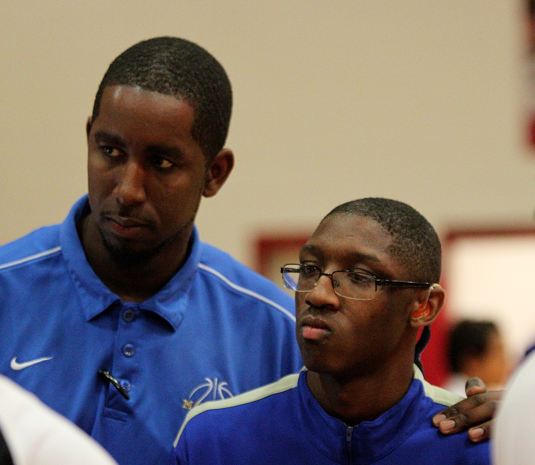 Coach Landis McCoy and Chris Moore. Photo by Jeff Dawsey