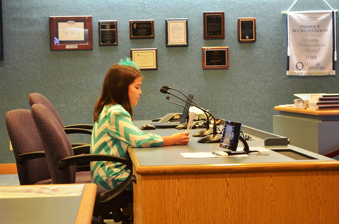 Annabella Olivari, fifth grader at Pine Trail Elementary, spoke against uniforms at a School Board meeting. One comment was that they would be uncomfortable most of the year. Photo by Wayne Grant