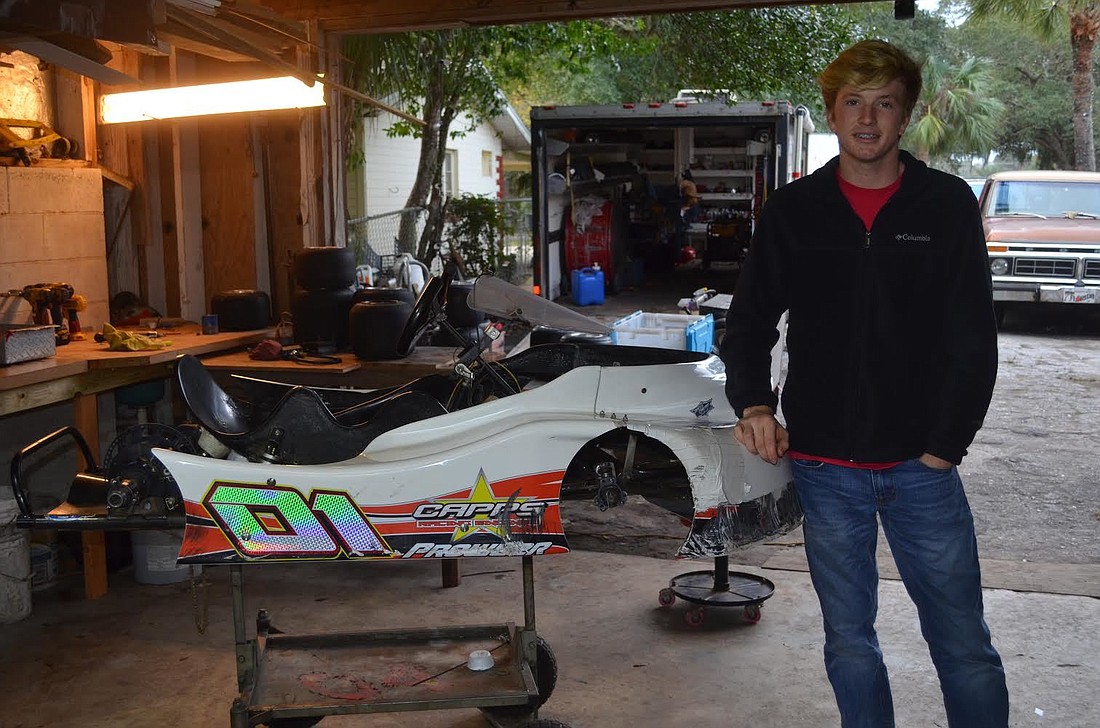 Ryan Anderson, 17, with his "01" go-kart (photo by Emily Blackwood).