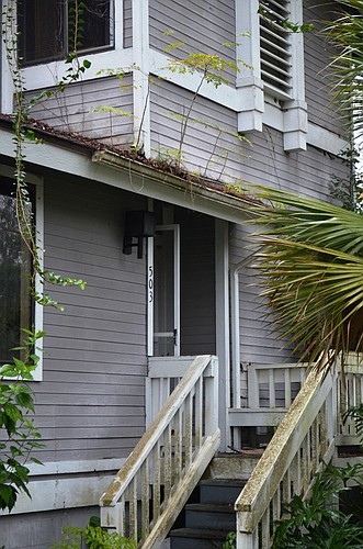 Plants are growing out of the gutter and wood is deteriorating on this Ormond Beach townhouse.Wayne Grant