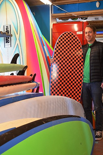 Rick Gehris, shown in his Safari Surf Shop, is expanding into the restaurant business.