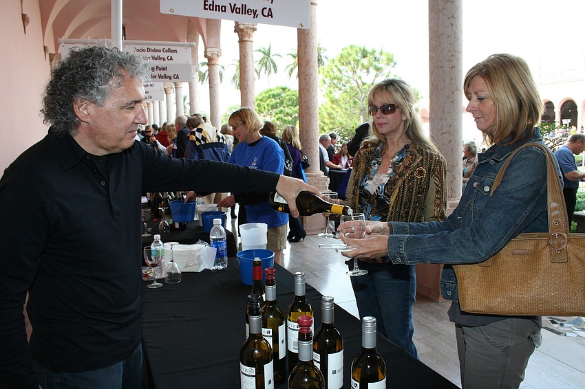 Tom Hannon pours for Marcia Dove and Kim Schreiber
