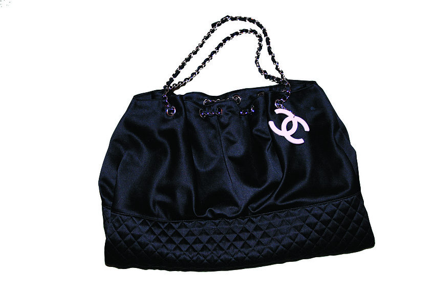 CHANEL 
HANDBAG
'This satin tote was a birthday present - I like it because itâ€™s not your traditional Chanel bag.'
