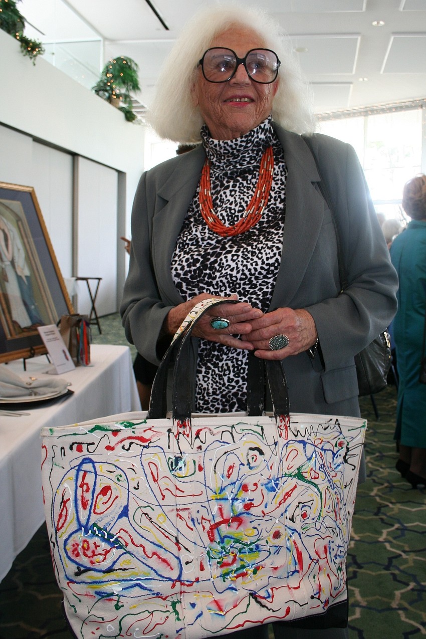 Florence Putterman and the tote she painted for the Chinese Auction