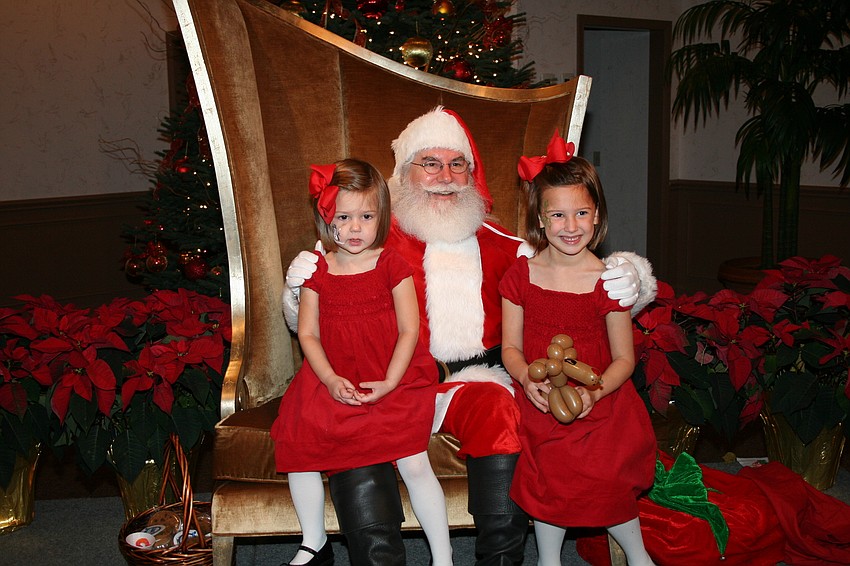 Eliza and Isabelle Radford with Santa