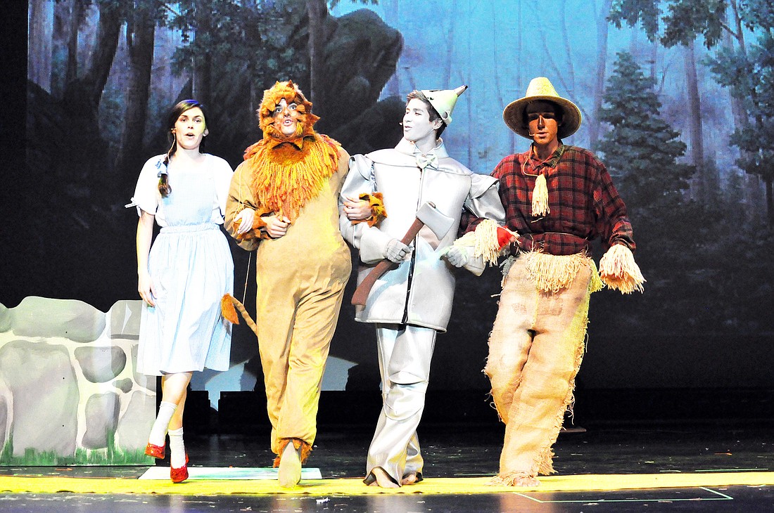 Dorothy, the Cowardly Lion, Tinman and Scarecrow, played by Caitlin Hannan, Chris Skraba, Nick OÃ¢â‚¬â„¢Connor and Eddie Green, respectively, follow the yellow brick road. PHOTOS BY SHANNA FORTIER