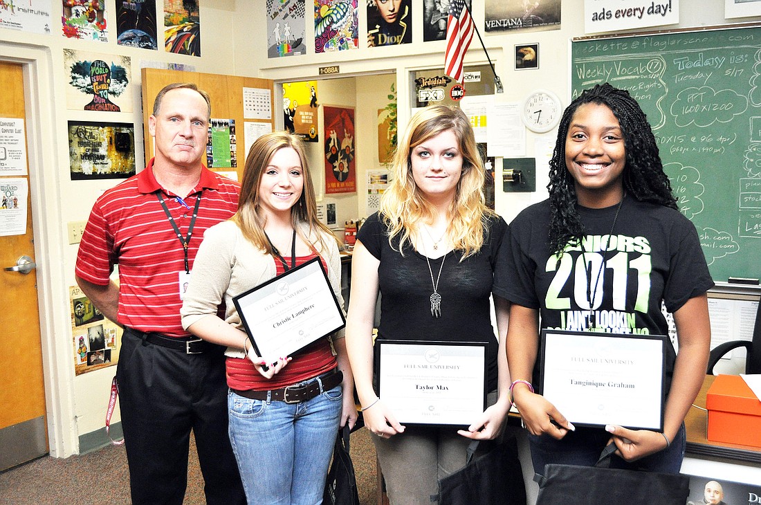 Teacher Ed Beckett and students Christie Lamphere, Taylor Max and Tanginique Graham. PHOTO BY SHANNA FORTIER