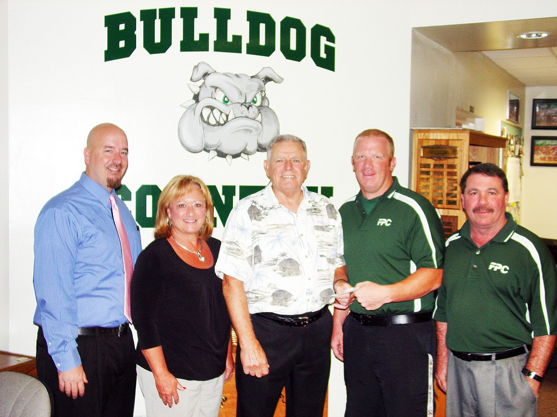 From left: Jacob Oliva, principal; Linda Sims, coach; Jack Sciuto, Sherry Misrock trust director; Steve Poppe, coach; and Steve DeAugustino, athletics director. COURTESY PHOTOS