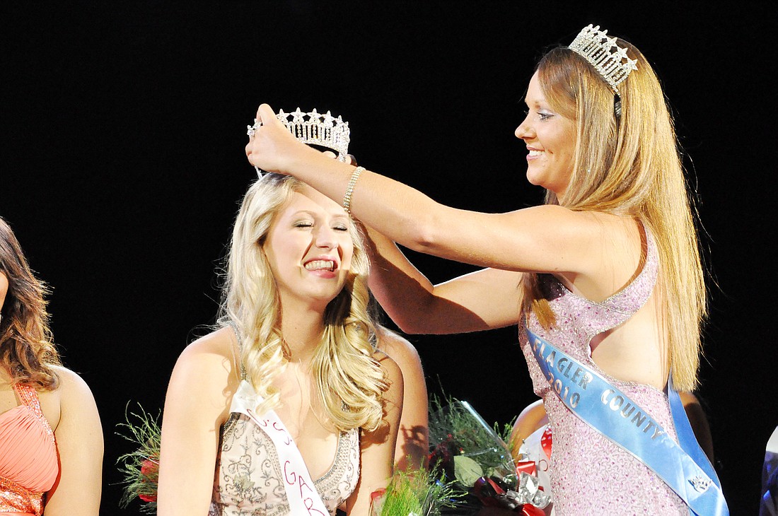Miss Flagler County 2010 Amanda Dack crowns Alexa Linn Gardner as Miss Flagler County 2011.