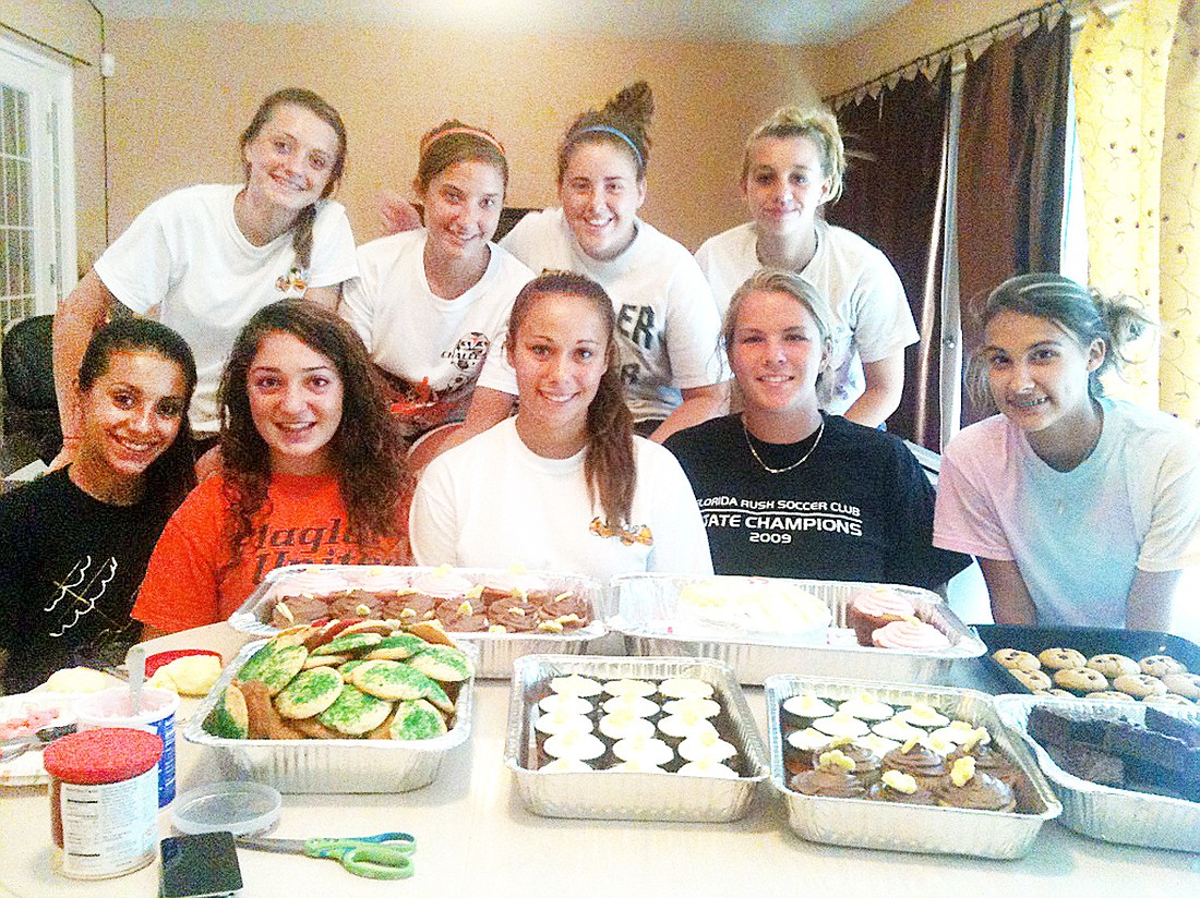 The Flagler Palm Coast girls soccer team baked goodies and delivered them last week to various fire stations throughout Palm Coast. COURTESY PHOTO