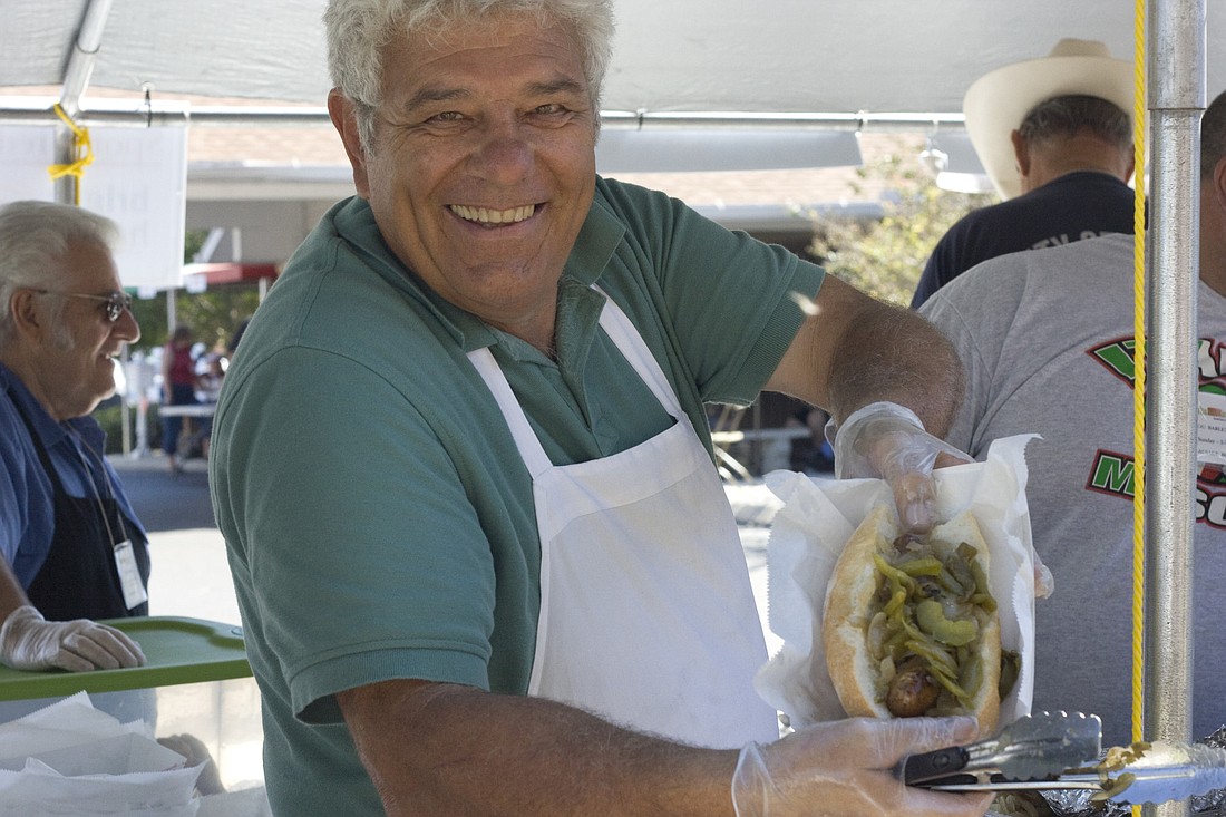 Jerry Esposito makes sausage and pepper sandwiches at the 2010 Italian American Festa.