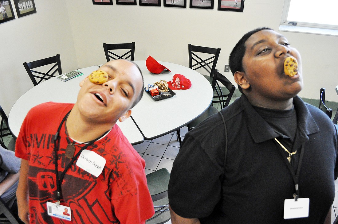 Donovan Daniels and Brandon Singh attempt to transfer cookies from their foreheads to their mouths without using their hands. PHOTOS BY SHANNA FORTIER