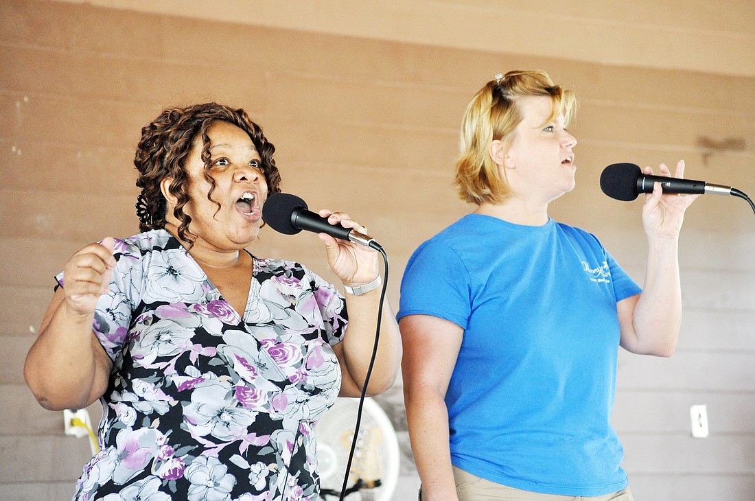 Kathleen Robinson and Allison Walker, of Nevaeh, sing at the Christian Music Fest. PHOTOS BY SHANNA FORTIER