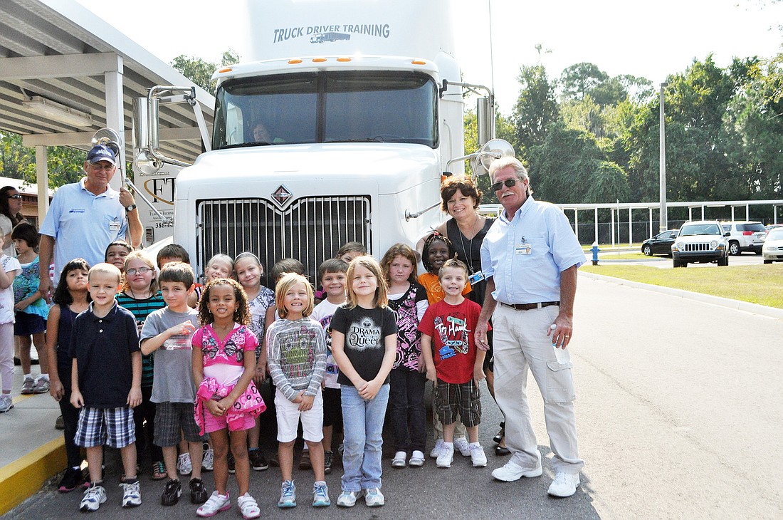 Bob DeJoy and David Nelson, of Flagler Technical Institute, show Robin HockadayÃ¢â‚¬â„¢s first-grade students the ins and outs of a semi-trailer. PHOTOS BY SHANNA FORTIER