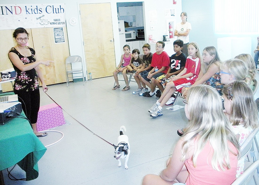 Dr. Erika Mendez and Mimi entertain students at the KIND Kids September meeting. COURTESY PHOTO