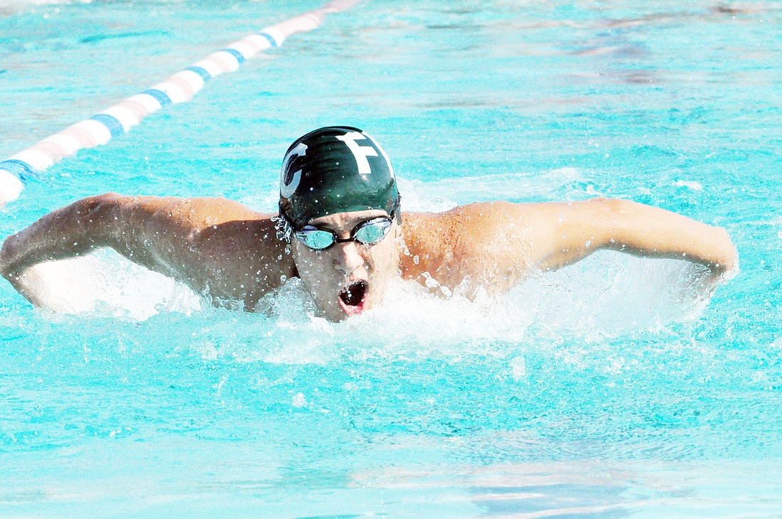 Nick Montross finished the 100-meter butterfly in second place with a time of 1 minute, 7 seconds. PHOTOS BY ANDREW O'BRIEN