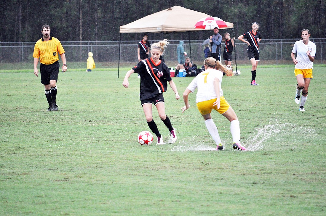 Katie Winters, of U15 FC United Black, possesses the ball in the first half Saturday, Oct. 8, against Ponde Vedra Storm Gold. FC United won the match, 2-0, to open its 2011 Lotto Invitational campaign.