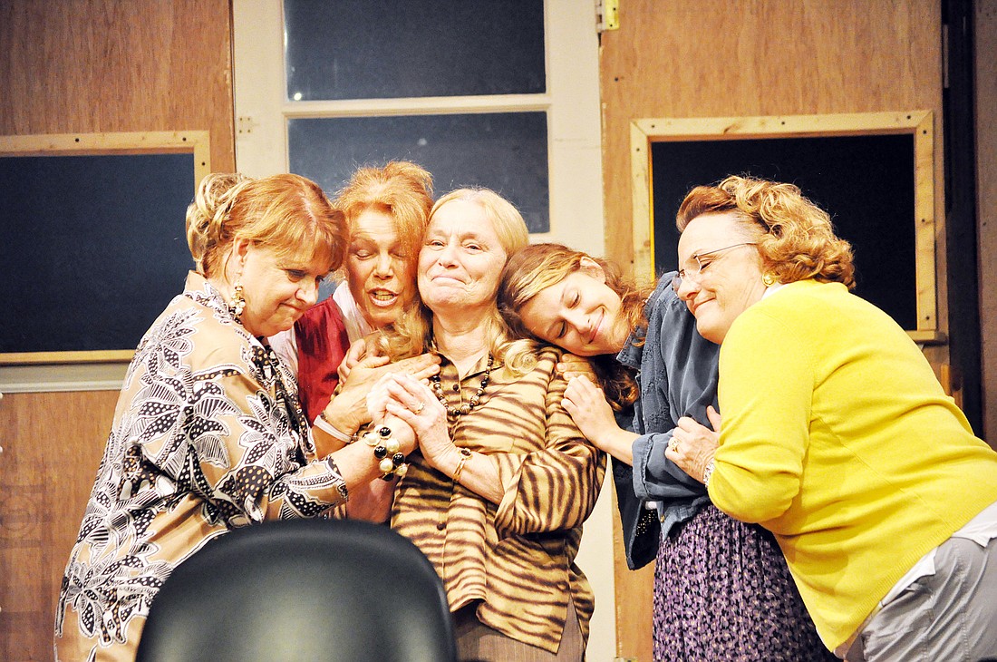 The cast of Ã¢â‚¬Å“Steel Magnolias,Ã¢â‚¬Â Debby Petty, Laureen Faulkner, Pat Love, Sarah Rogers and Cynthia Frederickson, embrace in the last scene of the show.