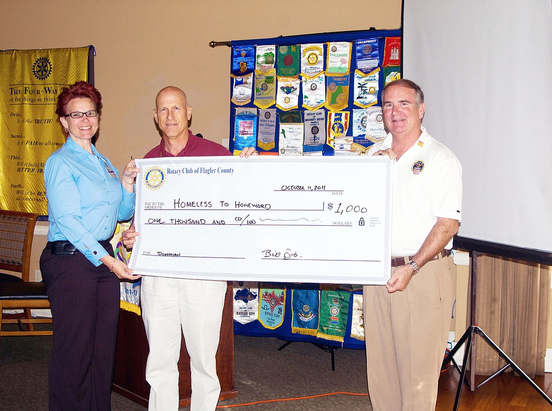 Katrina Townsend, student services director of Flagler County Schools; Bill Butler, president of the Rotary Club of Flagler County; and Rick Staly, president-elect of the Rotary Club of Flagler County. COURTESY PHOTO