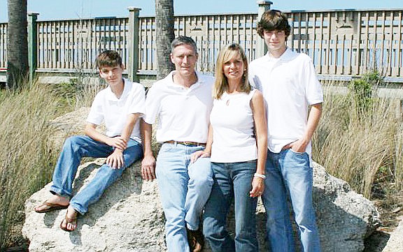 Jay Gardner poses with his wife, Lisa, and his sons, James and Adam.