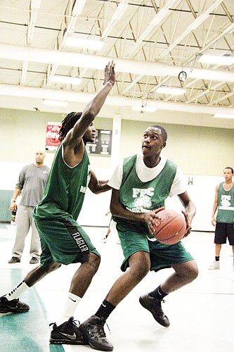 Willie Gardner tries to block teammate Chris Lubin in practice Monday, Nov. 14, at FPC. PHOTOS BY SHANNA FORTIER
