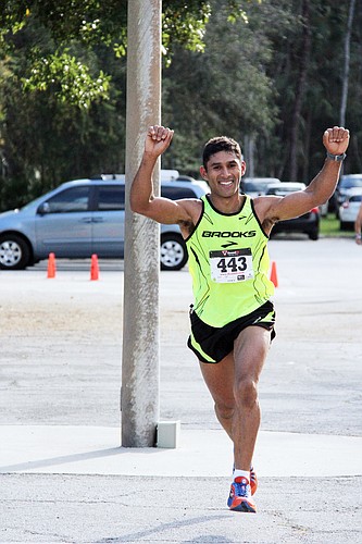 Jose Musso, of Palm Coast, won the 15K, finsihing in 58 minutes, 17 seconds. PHOTOS BY SHANNA FORTIER
