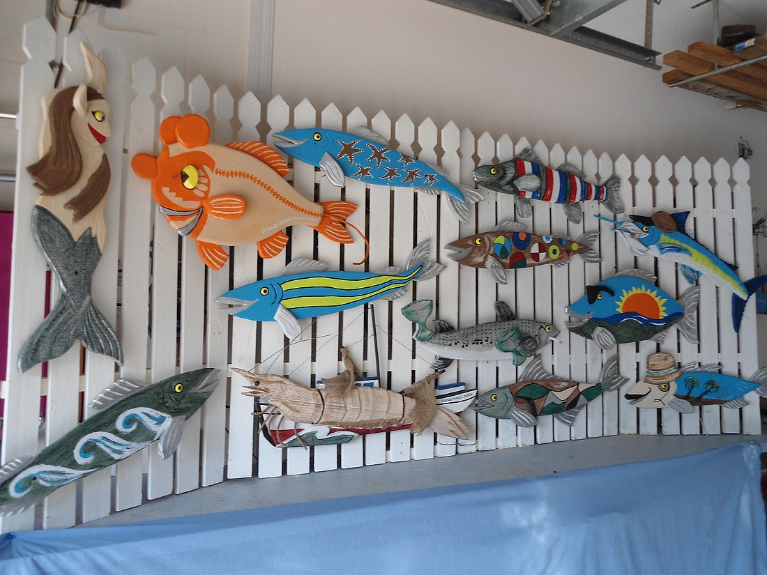 Robert Dulong's fish folk art will be among the works for sale.