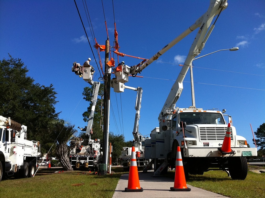 This pole was being worked on with four trucks Monday, near Palm Coast Parkway and Pine Lakes.