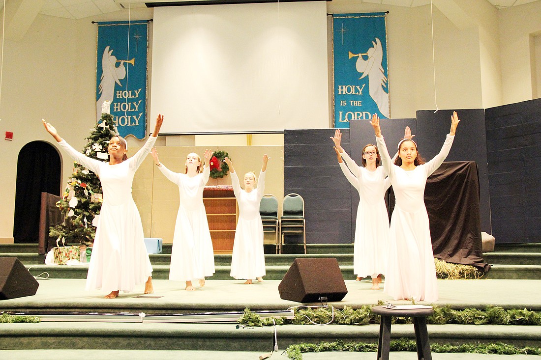  The interpretive movement team played the part of angels in the play. PHOTOS BY SHANNA FORTIER
