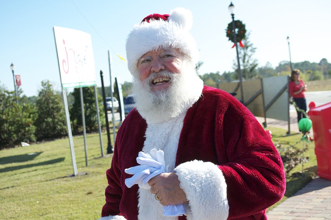 Santa makes his entrance into Town Center before the 2010 Holiday Starlight Parade.
