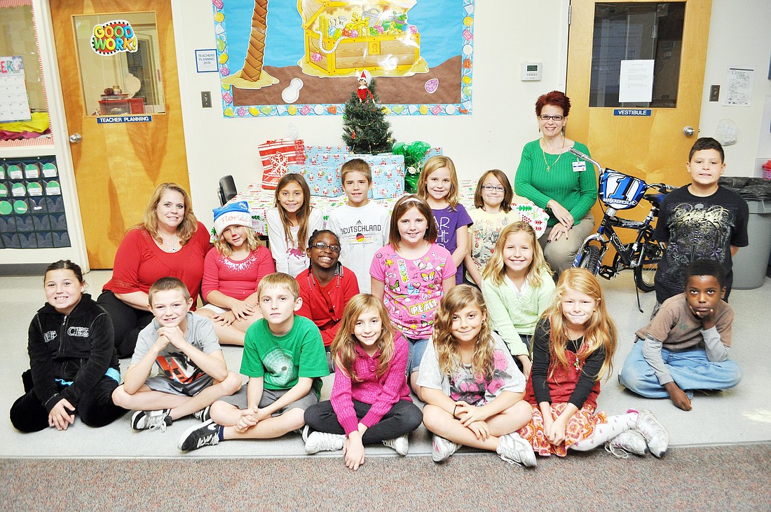 Michelle PattonÃ¢â‚¬â„¢s third-grade class at Old Kings Elementary School donated presents to the Flagler Christmas Angels Program. PHOTO BY SHANNA FORTIER