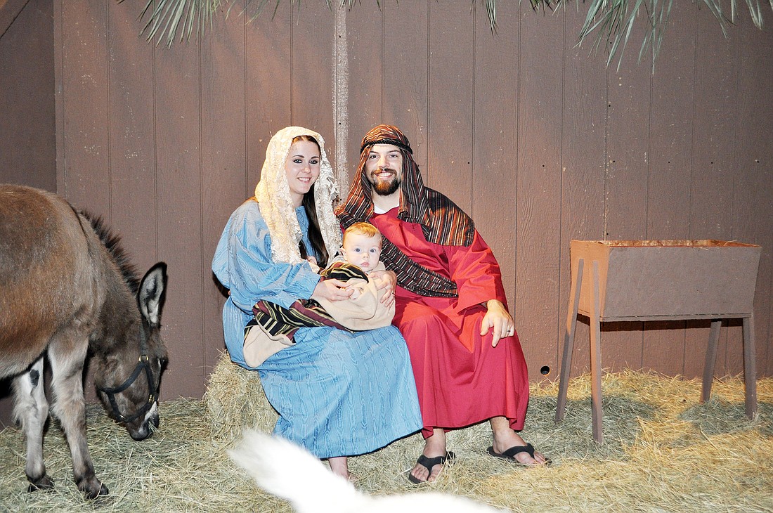 Julie and Issac Hackler, with their son, Jacob, play Mary, Joseph and baby Jesus in the birth scene.