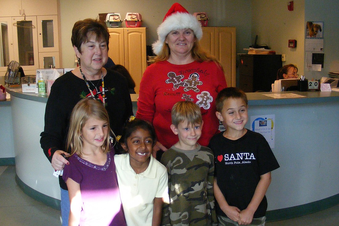 Back row, from left: teachers Mary Narina and Annette Thompson; front: students Bailey Holmes, Abigail Seetaram, Willy Blanton and Stephen Pelley