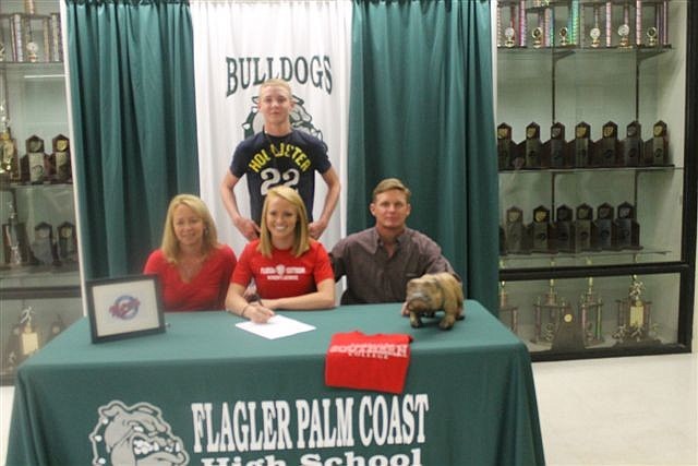 Cassie Crain (middle) will play lacrosse at Florida Southern College, in Lakeland.