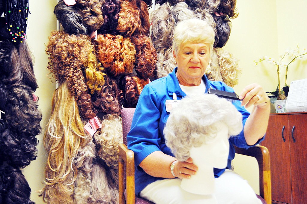 Five-year volunteer Jan Proctor styles a wig in the Judith C. Macko Cancer Resource Library, at Florida Hospital Flagler. COURTESY PHOTO