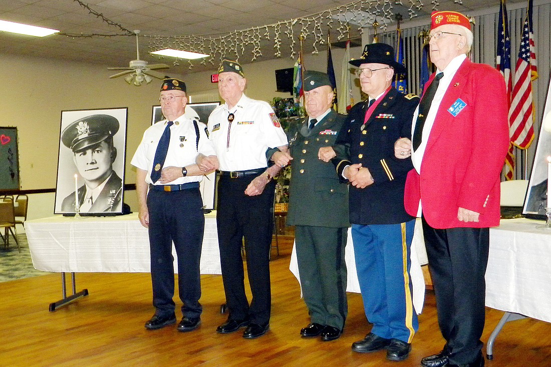 Veteran organizations Chaplains Ken Wall, Julius Goodman, Harry Gilman, Howard Schwartz, and Henry Gensch link arms as the Four Chaplains supposedly did on the sinking ship in 1943. COURTESY PHOTOS