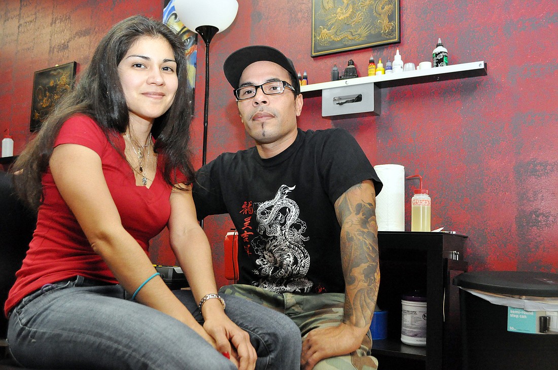 Ã¢â‚¬Å“GageÃ¢â‚¬Â Pou, right, opened Asian Armor Tattoo Company with his girlfriend, Giselle Correno, in January.