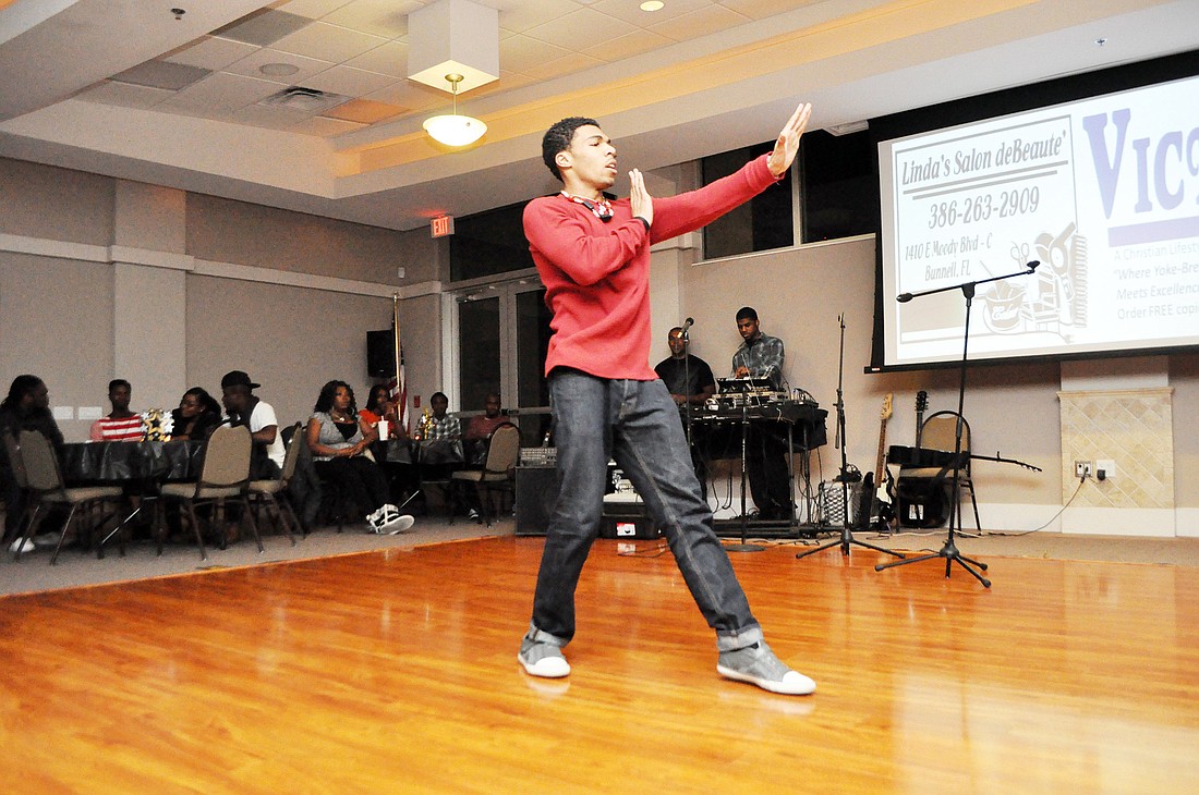 Ryan Ragsdale dances at the first .COM, Christian Open Mic. PHOTOS BY SHANNA FORTIER