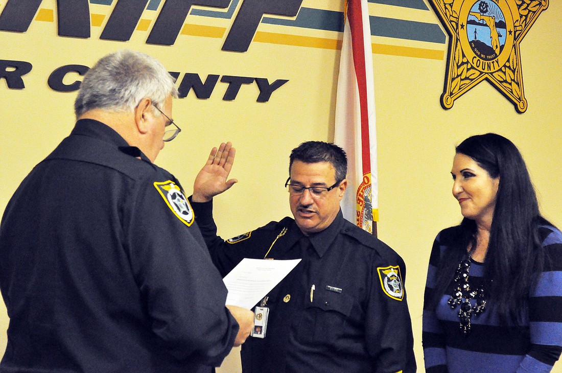 Sheriff Donald Fleming conducted the ceremony in which David OÃ¢â‚¬â„¢Brien was promoted from major to chief deputy. OÃ¢â‚¬â„¢BrienÃ¢â‚¬â„¢s fiancÃƒÂ©e, County Commissioner Milissa Holland, pinned the badge. PHOTO BY OBSERVER STAFF