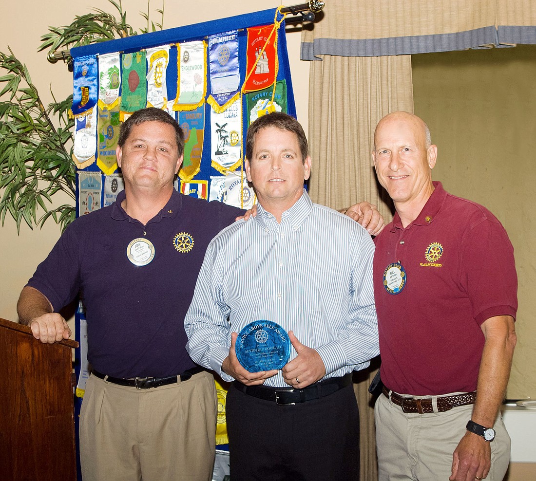 Rotary President Joel Fallon; Eddie Schatz, of Austin Outdoors; and Rotary President-Elect Bill Butler. COURTESY PHOTO