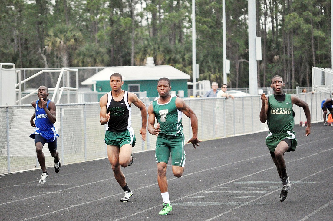 Tyler Cue (third from left), who has been nursing a hamstring injury, finished in first place in the 100- and 200-meter dashes Wednesday, April 20, at the District 1-4A meet. Cue qualified for the regional meet in both races. PHOTOS BY ANDREW O'BRIEN