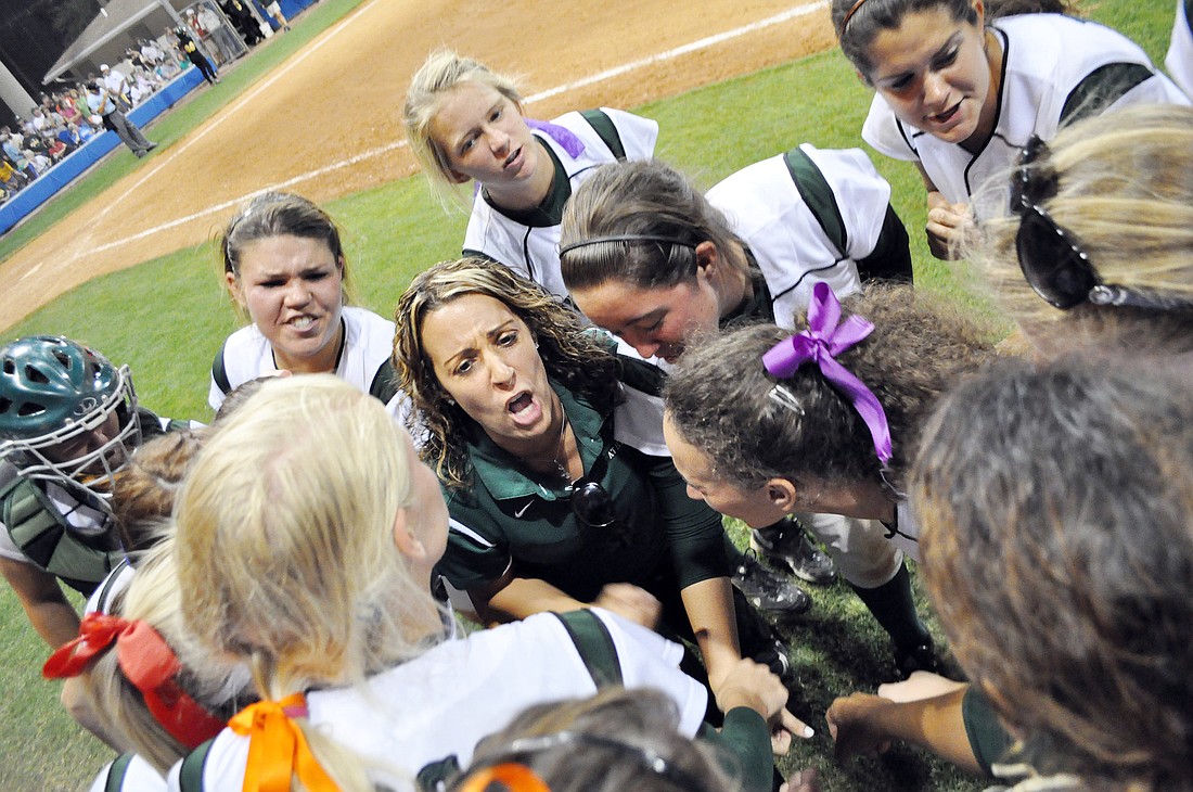 Flagler Palm Coast coach Sarah Poppe fires her team up during the late innings. PHOTOS BY ANDREW O'BRIEN