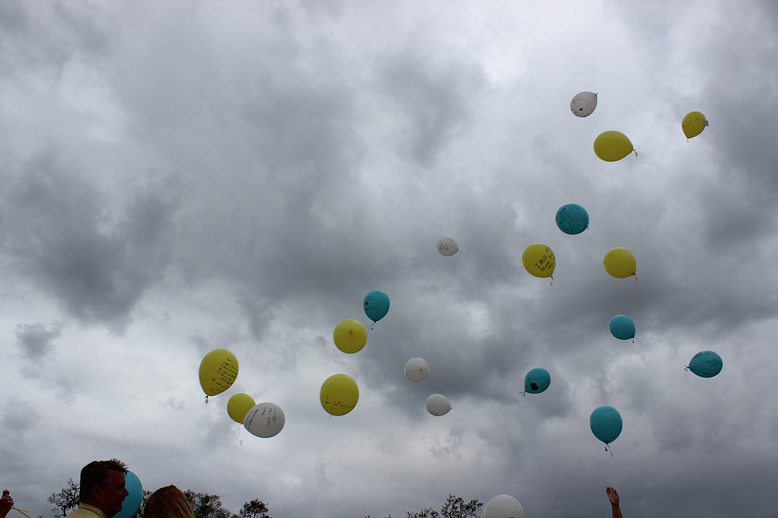Balloons were released in honor of Trish DeWitt (Photo by Emily Blackwood).