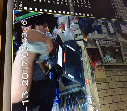 A photo of the suspect as he jumped over the  counter.