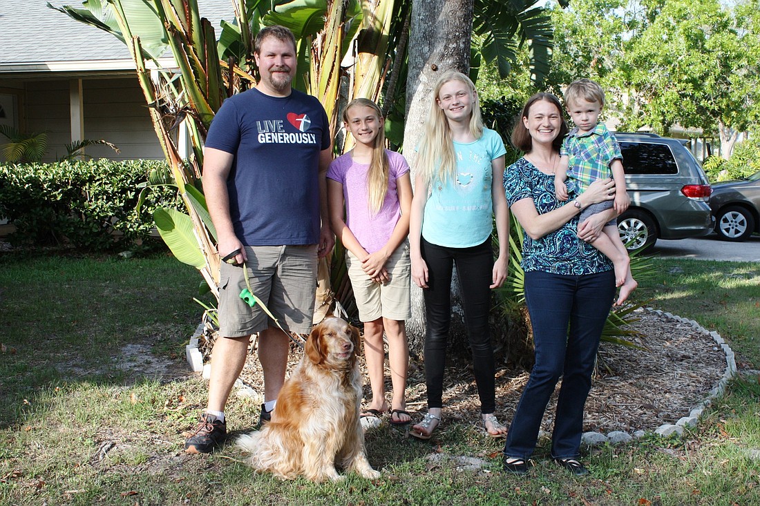The Epstein family will be in Haiti for a year. Shown are Matt, Kelilah, Genesis and Lauren, holding Micaiah. The dog, Sir Nibbles, is also going. Photo by Wayne Grant